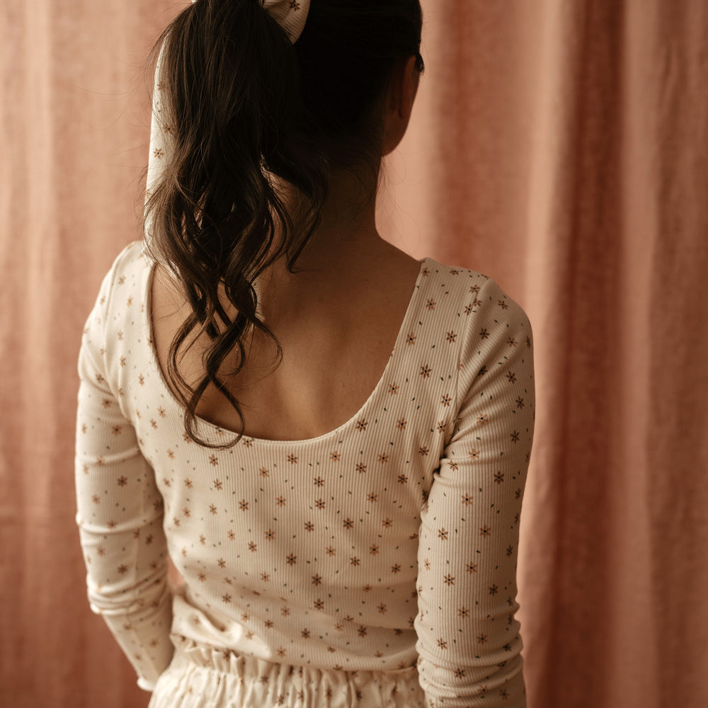 
                      
                        Sleeveless top tiny floral vanilla
                      
                    