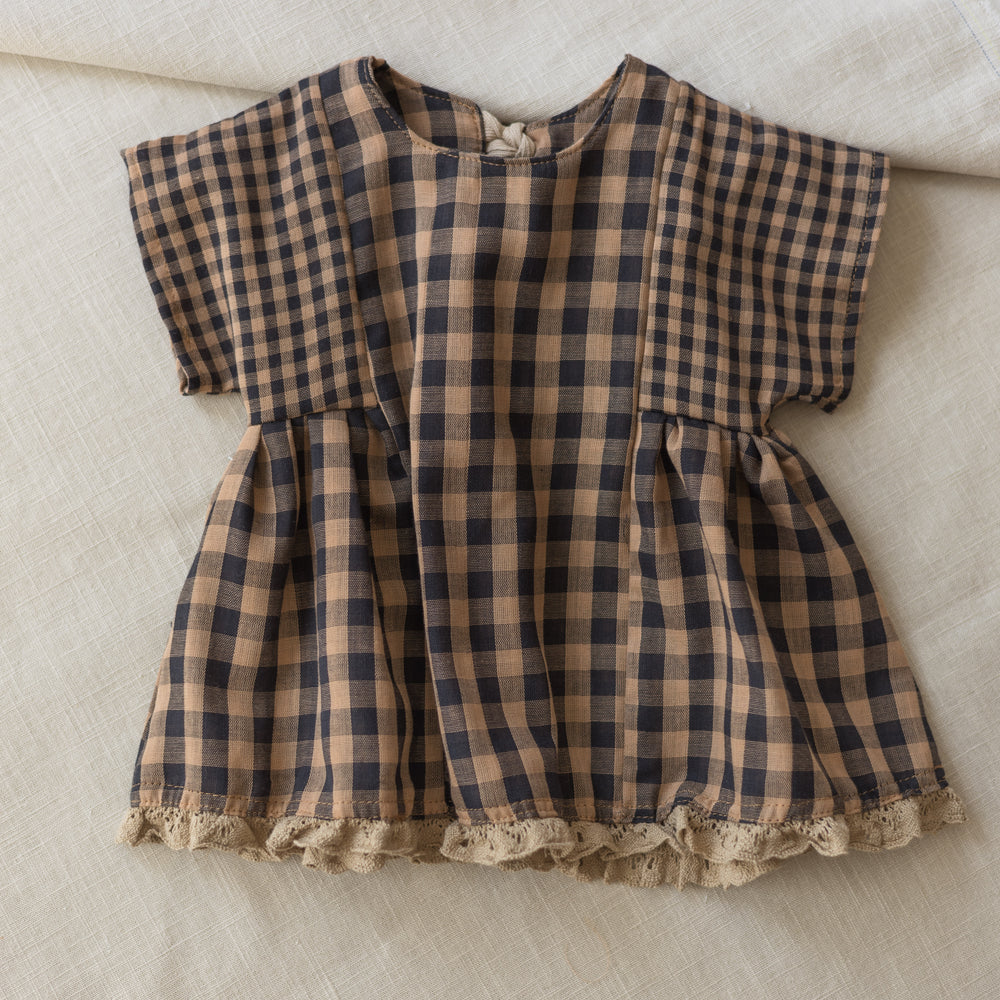 
                      
                        Malia baby dress / checkers - cacao
                      
                    