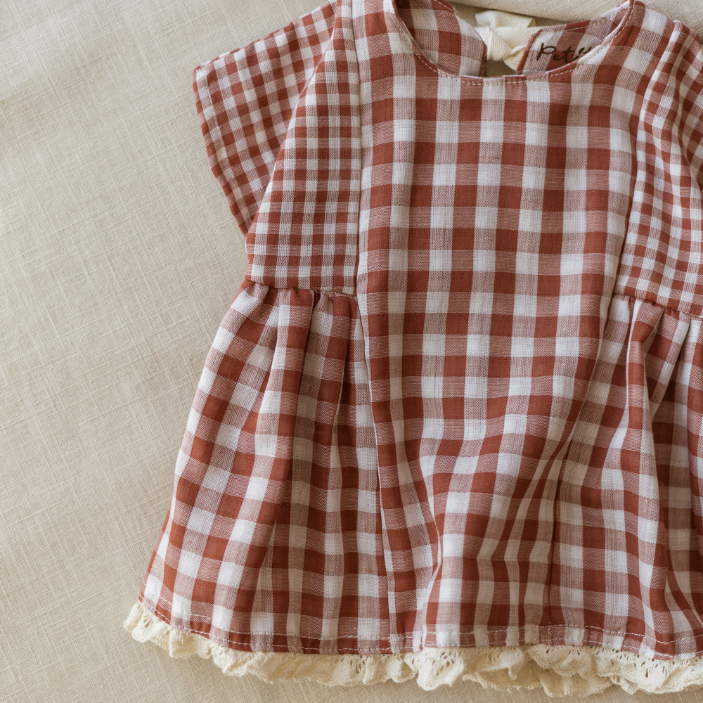 
                      
                        Malia baby dress / checkers - brick
                      
                    