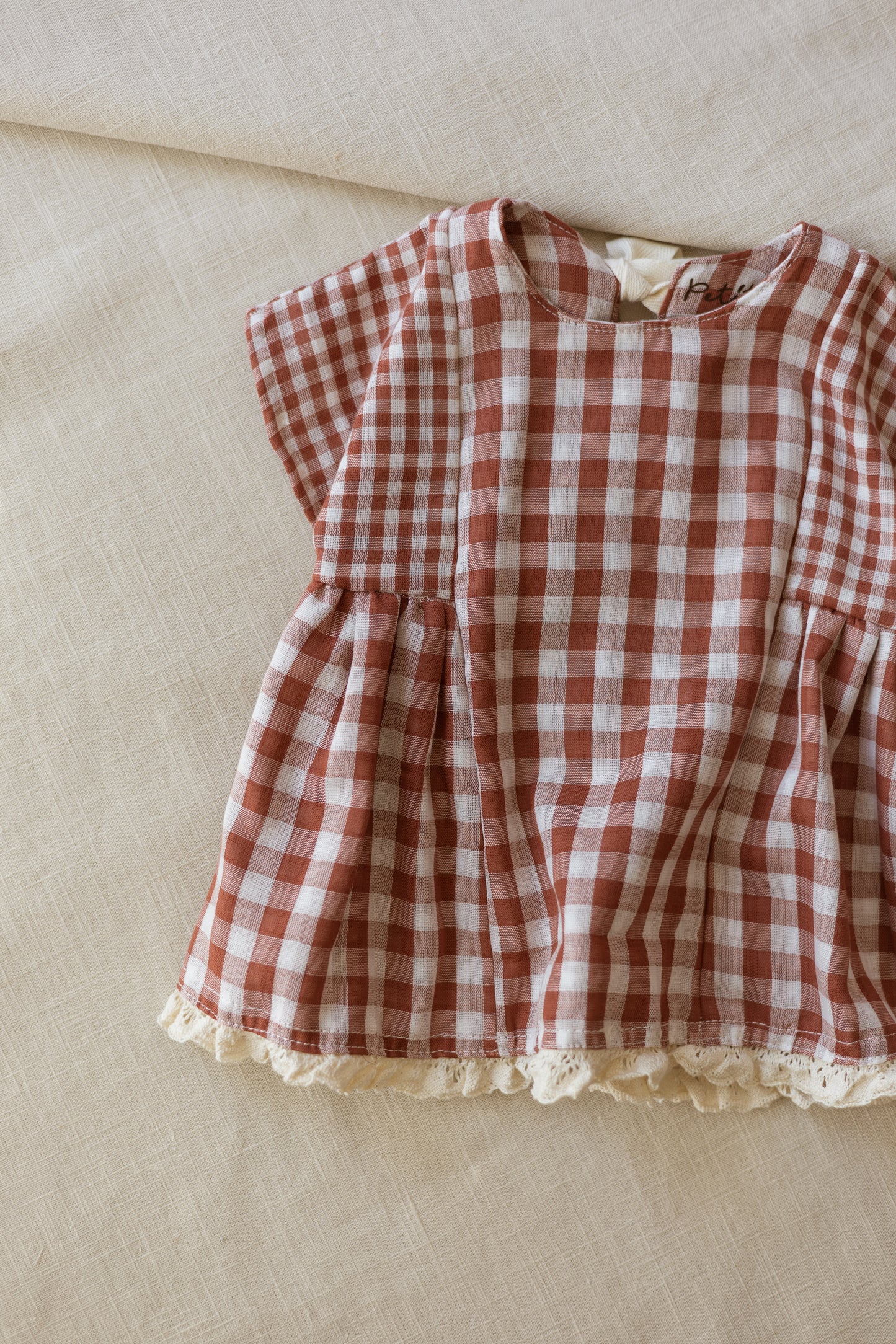 Malia baby dress / checkers - brick