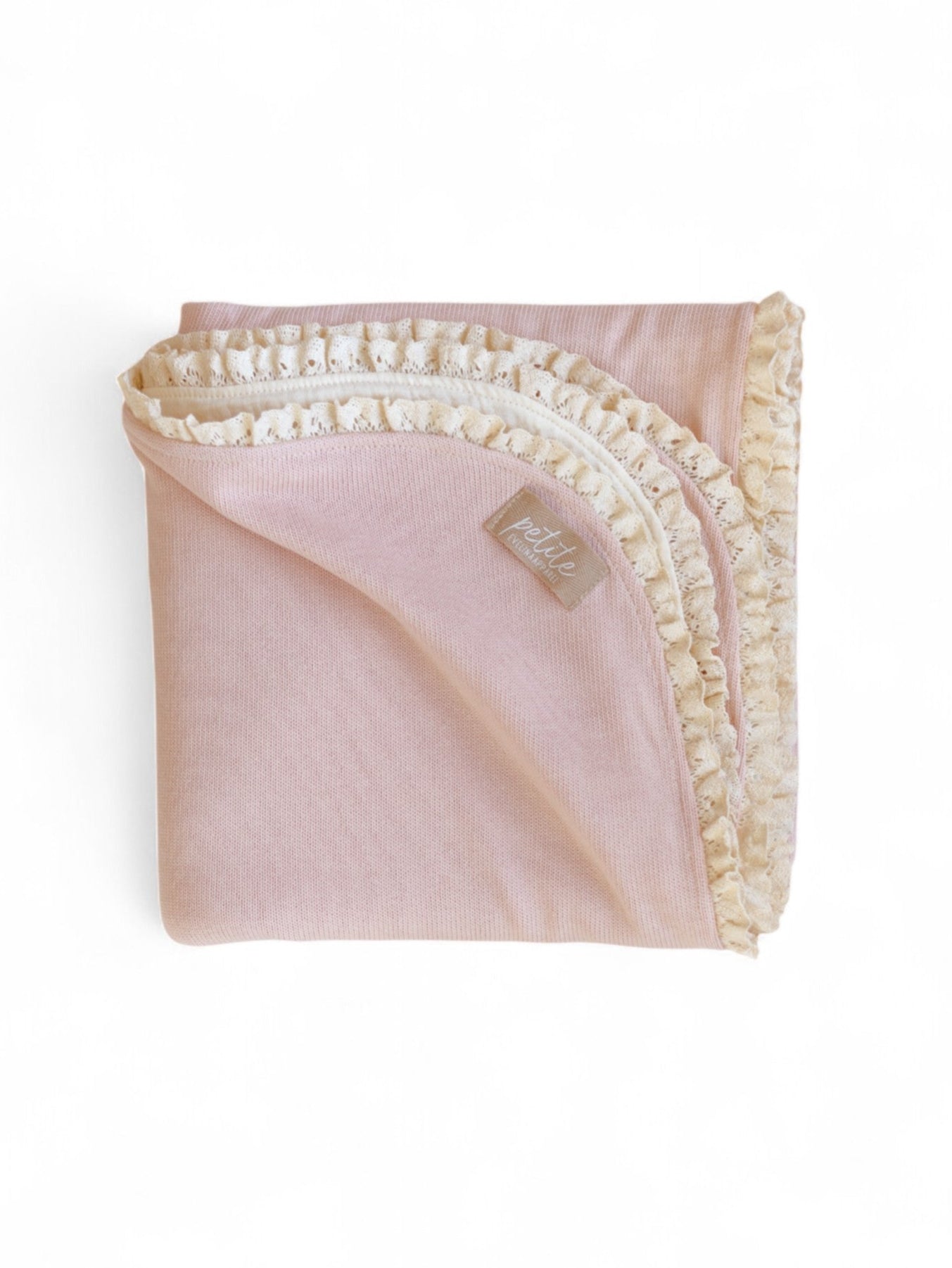Pink blanket with white lace trim 