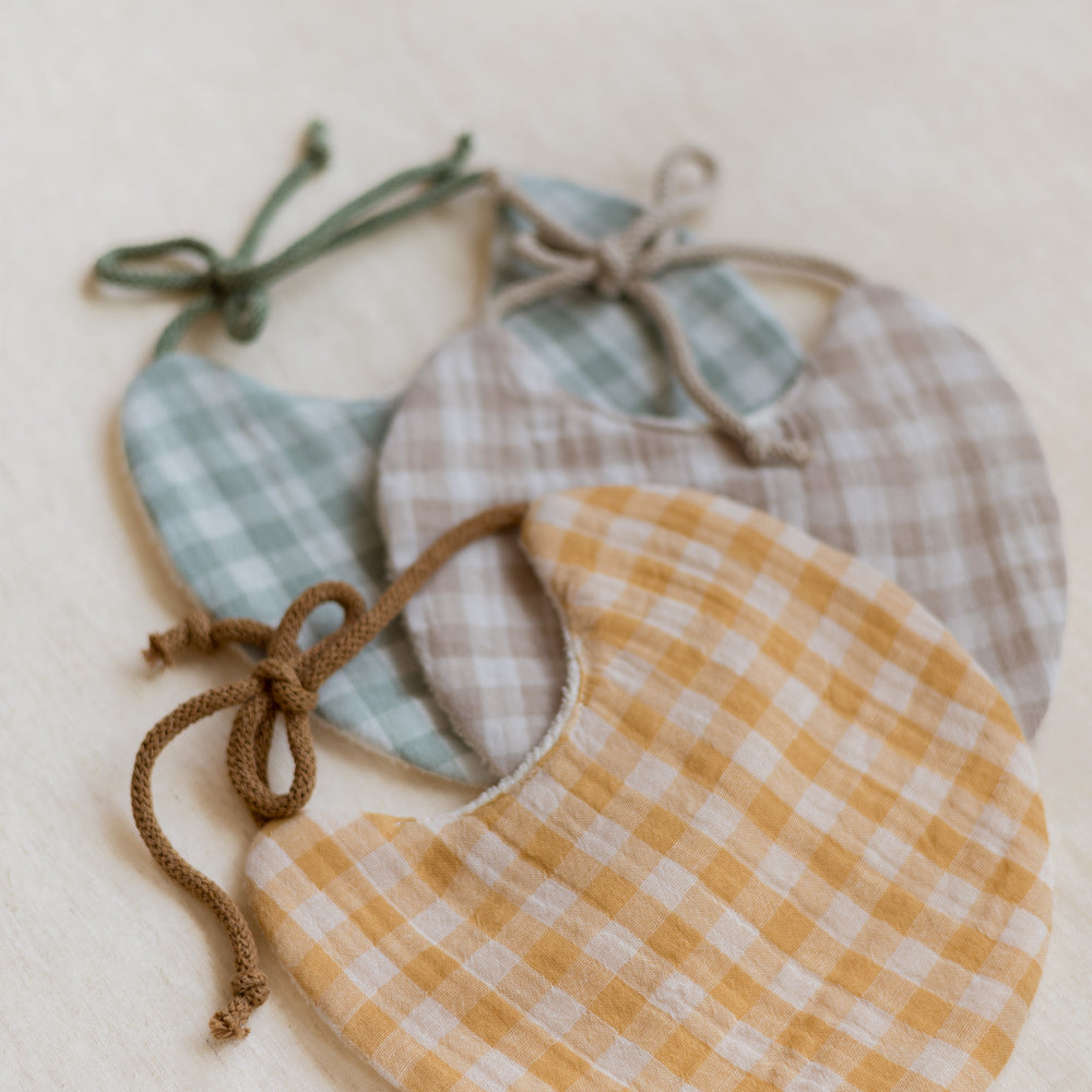 
                      
                        Baby bib / Beige Checkers
                      
                    