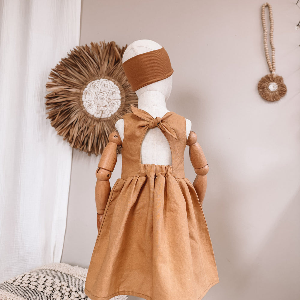 
                      
                        Arabella baby dress / linen - cinnamon
                      
                    