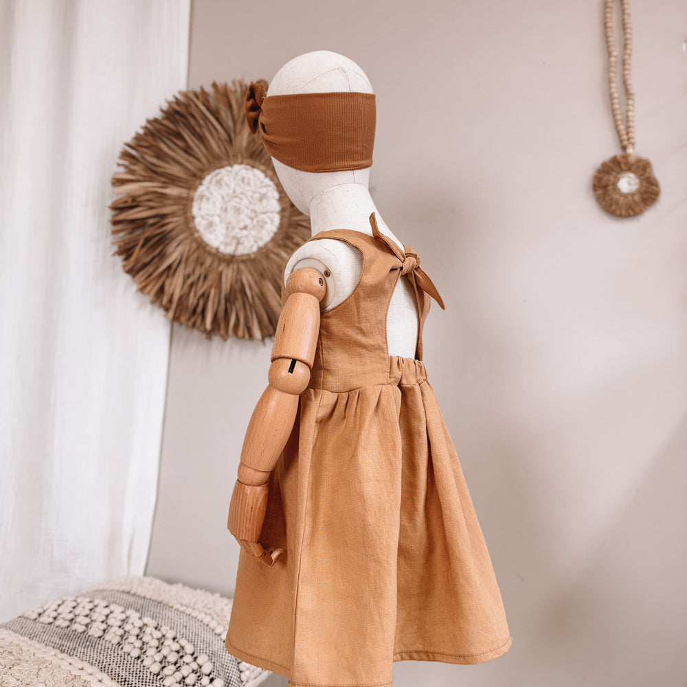 
                      
                        Arabella baby dress / linen - cinnamon
                      
                    