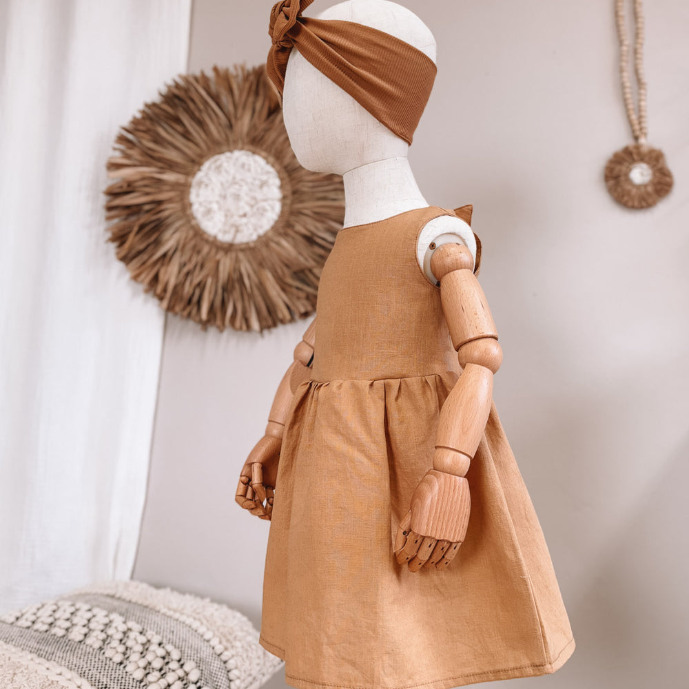 
                      
                        Arabella baby dress / linen - cinnamon
                      
                    