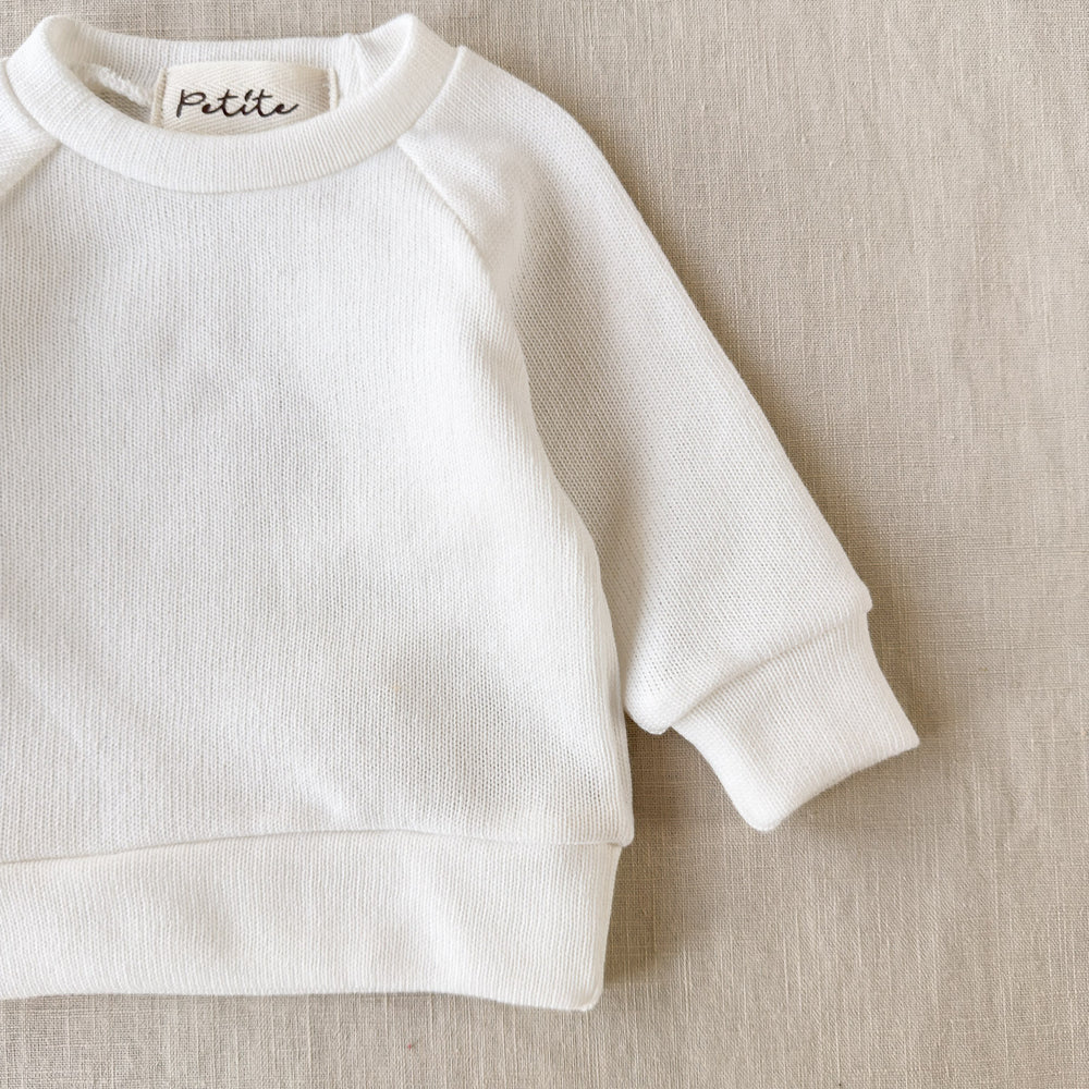 
                      
                        Knitted sweater / ivory
                      
                    